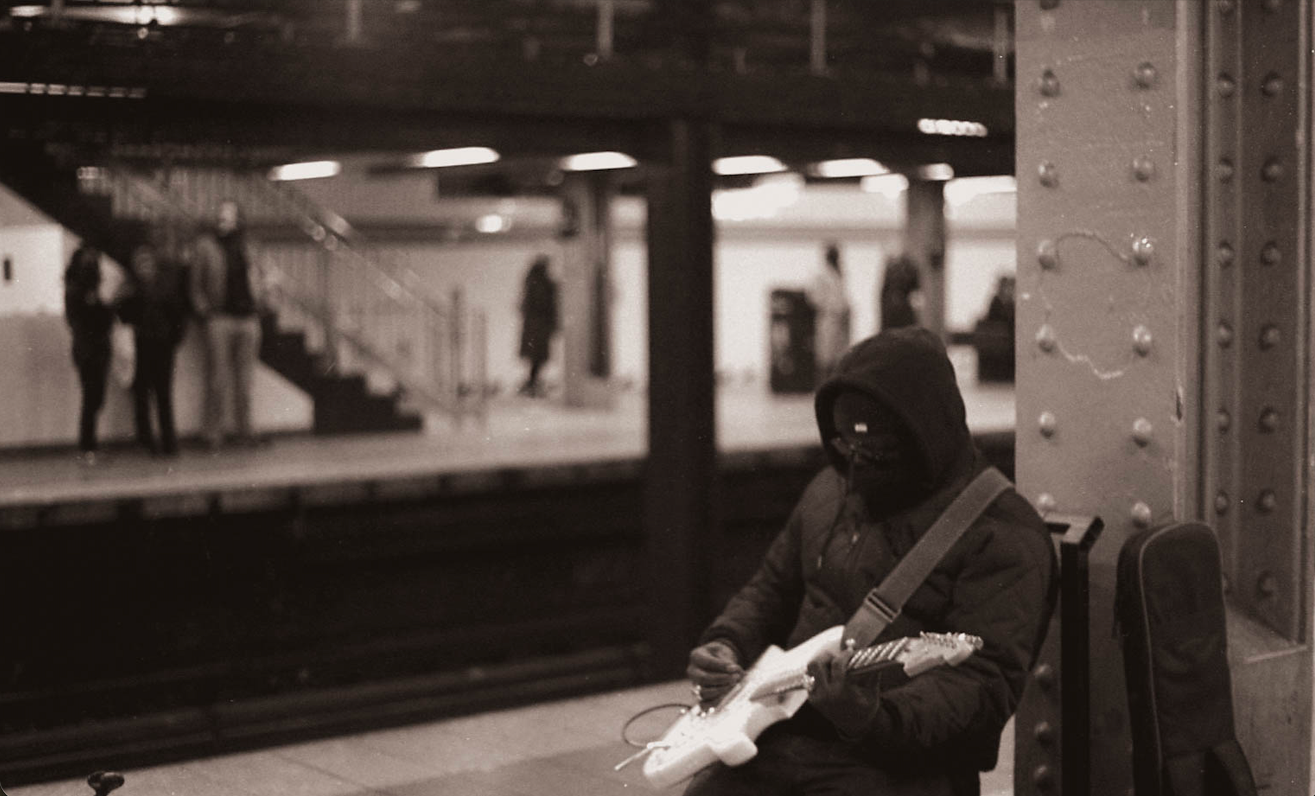 Guitar Player in the Subway